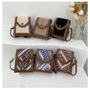 Detailed display of vintage quilted and ethnic woven crossbody phone bags for women