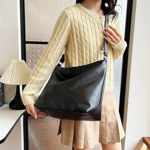 Black soft leather hobo bag with Fashion embossing and pebble texture for women