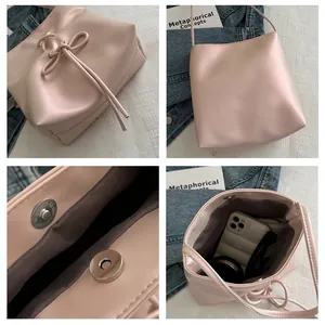 Détails du sac seau rose avec nœud décoratif et fermeture magnétique intérieure