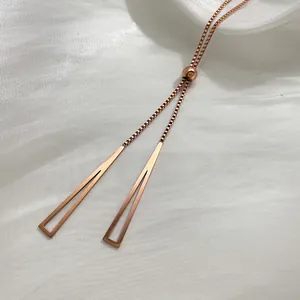 Elegant rose gold titanium sweater necklace with adjustable triangle tassel pendants