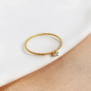 Luxurious gold titanium steel ring with mini diamond and textured beaded band design