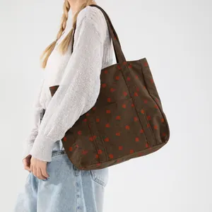 Brown corduroy tote bag with strawberry prints and a front pocket for women