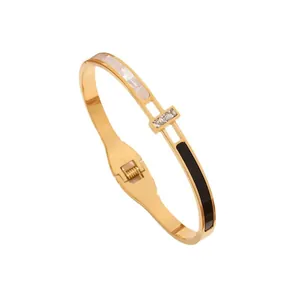 Golden titanium steel bangle with zircon shell inlay and hinge closure for women