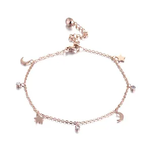 Rose gold stainless steel bracelet with star, crescent moon, and sparkling crystal charms