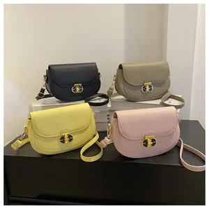 Detailed display of four textured PU leather saddle bags with elegant gold T-buckles
