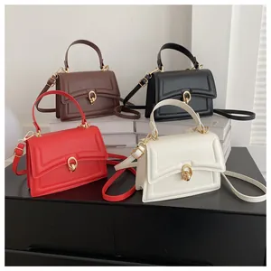 Collection of four stylish flap handbags in brown, black, red, and beige with gold rings