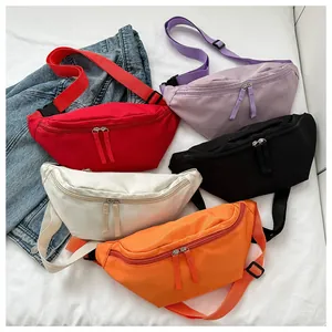 Detailed flat lay of versatile nylon waist bags in five vibrant colors with adjustable straps