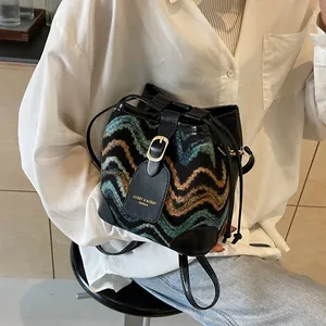 Chic multi-color wavy knit bucket bag with leather drawstring for casual daily use