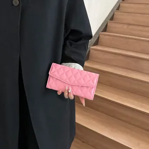 Pink quilted leather long wallet for women featuring a minimalist stitch pattern design