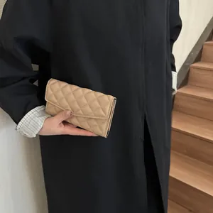 Quilted beige long wallet for women with geometric stitching and elegant metal trim