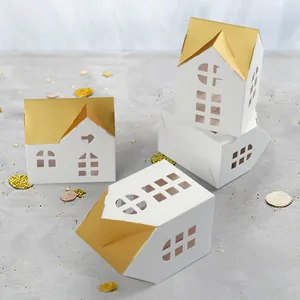 Elegant white house gift box with gold roof and laser-cut windows for wedding favors