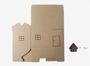 Detail of house-shaped kraft paper gift box with printed windows and small tag