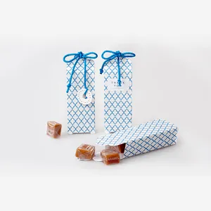 Detail of 3mm blue cotton rope tied as a decorative bow on a patterned gift box