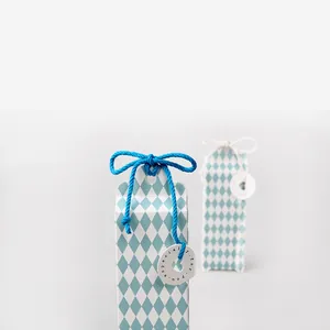Detail of 3mm colored cotton rope used for gift box packaging with decorative tags