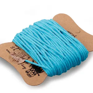 3mm bright blue cotton cord roll for DIY crafts and gift wrapping on cardboard