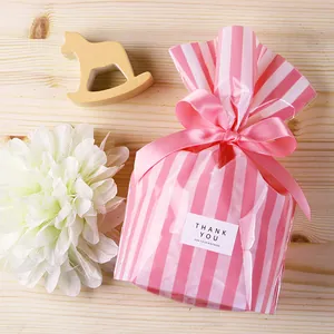Pink and white striped PP food gift bags with pink satin bows and thank you labels