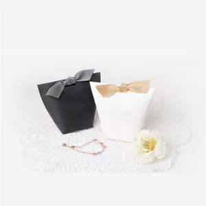 Minimalist black and white gift boxes with ribbon bows for jewelry and candy packing