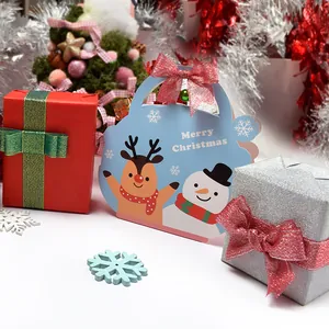 Christmas gift box set with festive ribbons, reindeer bags and glitter bows for holiday gifts
