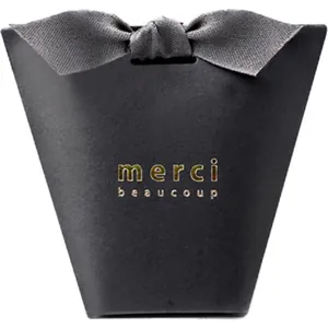 Elegant black trapezoid gift box with gold foil merci beaucoup text and grey satin bow