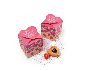 Pink strawberry gift box with heart-shaped closure and white floral lace detail