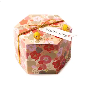 Hexagonal floral gift box with gold metallic rope decoration and decorative beads