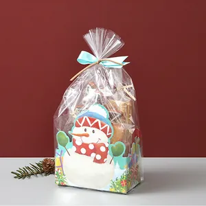 Christmas gift box set with snowman illustration, clear packaging, and blue ribbon decoration