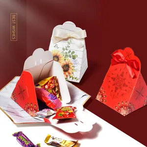 Creative Chinese wedding candy gift box with elegant red bow and traditional patterns