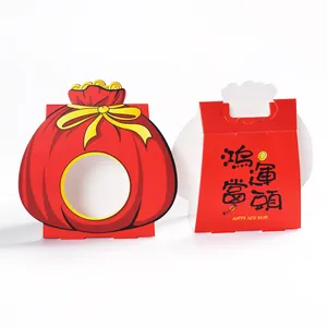 Red Chinese New Year gift boxes with festive calligraphy and window for candy packaging