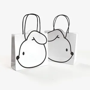 Minimalist white paper gift bag with creative cartoon dog head outline and black handles