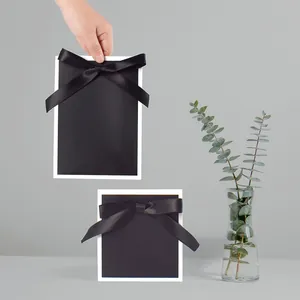 Minimalist black gift bag set with silk bows in square and rectangular shapes
