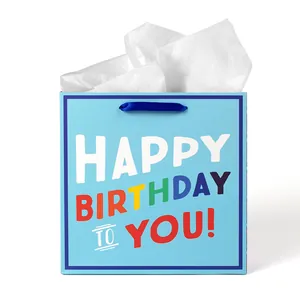 Sac cadeau bleu Happy Birthday avec anses en ruban bleu foncé et papier de soie