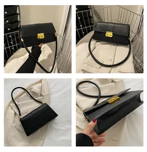 Detail shots of black crocodile texture shoulder bag with golden metal twist lock closure