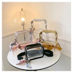 Detailed group view of colorful transparent PVC crossbody bags with decorative silk scarves