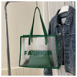 Transparent PVC tote bag with neon green leather trim and interior zipper pouch detail