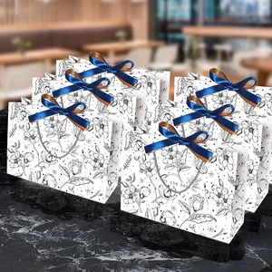 Vintage paper gift bags with floral patterns and luxury dark blue silk bow accents