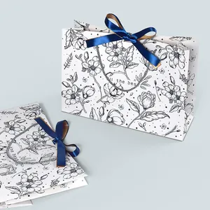 Vintage floral paper gift bag with dark blue silk bow and All the best print