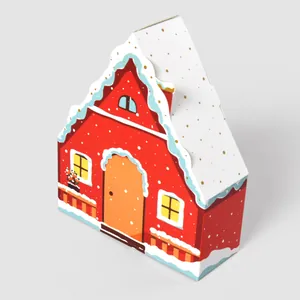 Festive red house-shaped gift box with snowy roof and golden dots for sweets and cookies