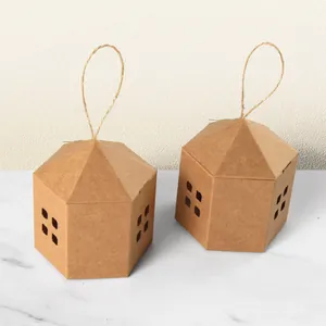 Minimalist house-shaped kraft paper gift boxes with twine handles and cutout windows