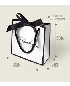 Detail showing 14x14x6cm small white gift bag with black bow and Thank You text