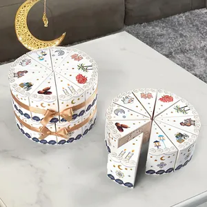 White triangle cake-shaped gift boxes for Ramadan party favors with gold ribbon