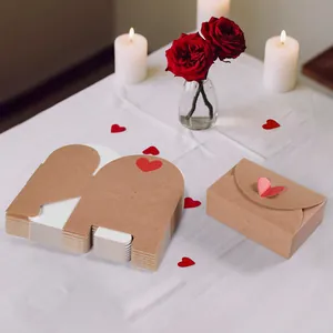 Brown kraft paper gift box with red heart detail and folded envelope design