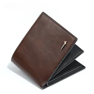 Close-up of vintage brown leather wallet with dual-tone metal trim and stitching detail