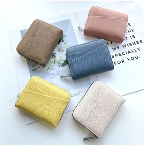 Detailed macro view of multi-color accordion card wallets in premium lychee pattern leather