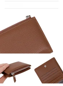 Detail of brown pebbled leather wallet featuring card slots and a secure zipper closure
