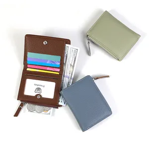 Macro shot of slim leather wallet showing multiple card slots and zippered coin pocket