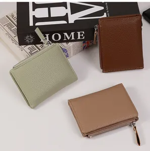 Three slim litchi grain leather wallets in green, brown, and khaki with metal zippers