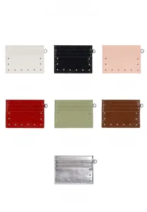 Detail view of rivet textured card holders in seven colors with metal ring and multiple slots