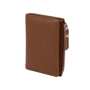Detail view of brown lychee grain leather wallet with side metal zipper and slim fold