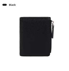 Detail of slim black pebbled leather bifold wallet with silver metal zipper closure