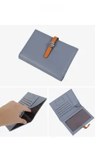 Detail showing the light blue pebble leather wallet interior with card slots and cash pocket
